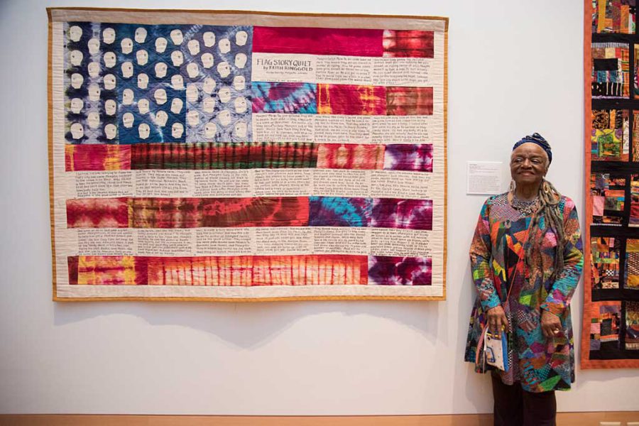 Renowned artist Faith Ringgold with her quilt