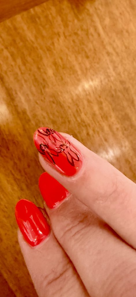 A fan with her own "bunny" nails!
